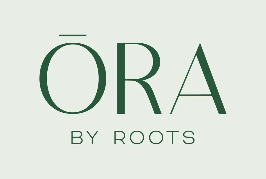 The ORA by Roots wordmark in green.