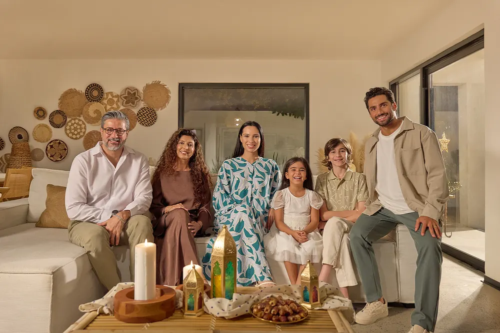 A family gathered for iftar in the campaign’s home set.