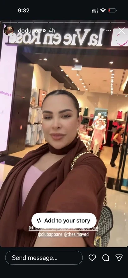 A creator filming a story at the entrance of a La Vie en Rose store.