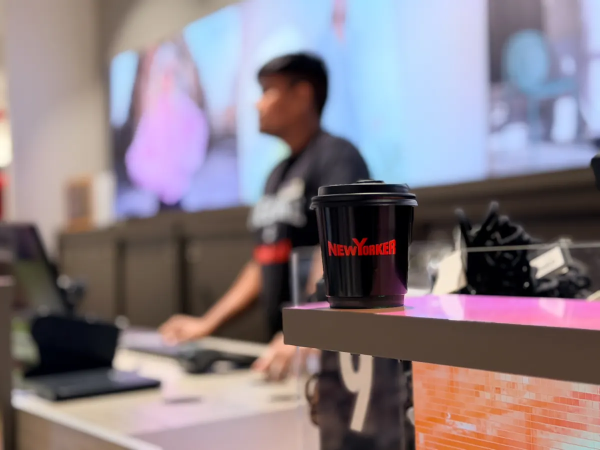 A NEW YORKER branded coffee cup on the counter at the Abu Dhabi Mall opening.