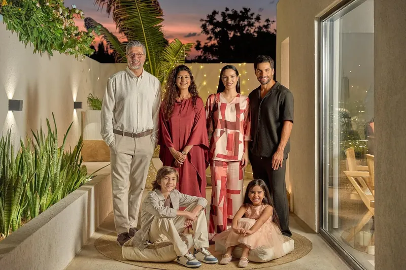 LC Waikiki Ramadan and Eid 2026 campaign photograph: a family portrait on a terrace at dusk.