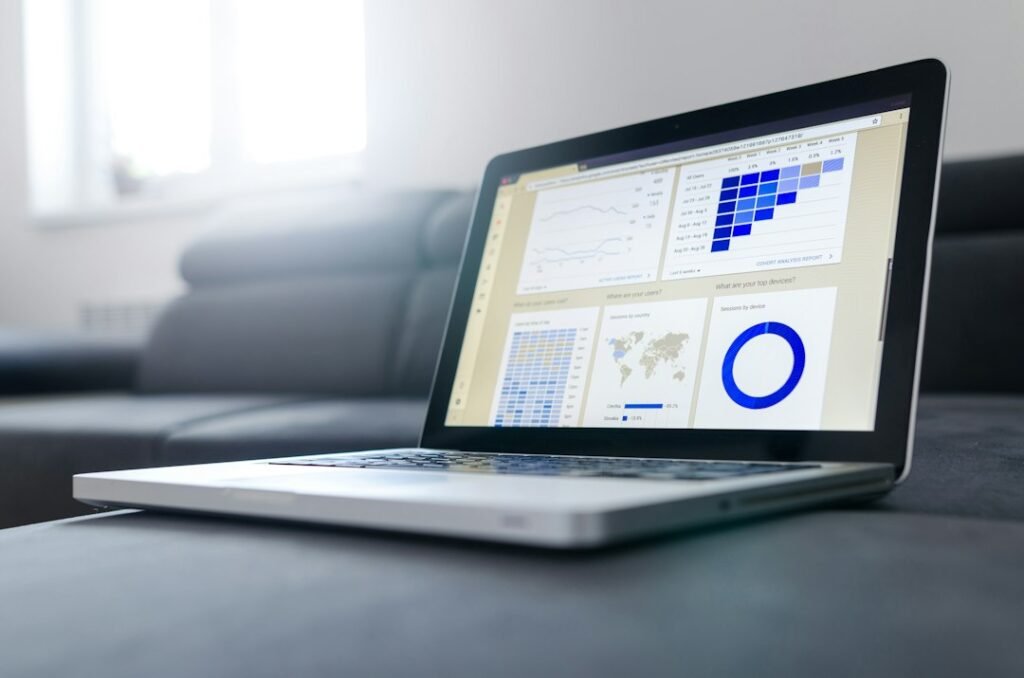 Notebook and business charts representing ecommerce growth planning